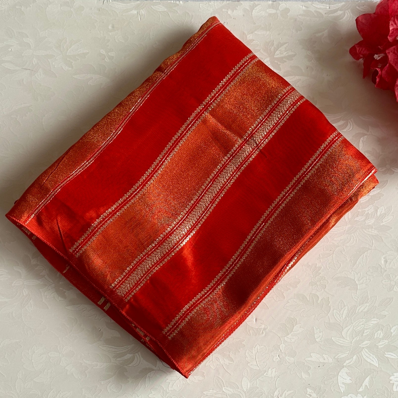 Vermilion Orangish Red Soft Tissue Crepe Saree With Metallic Gold Buttas And Stripes