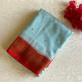 Powder Blue Banarasi Crepe Silk Saree With Scarlet Red Pallu