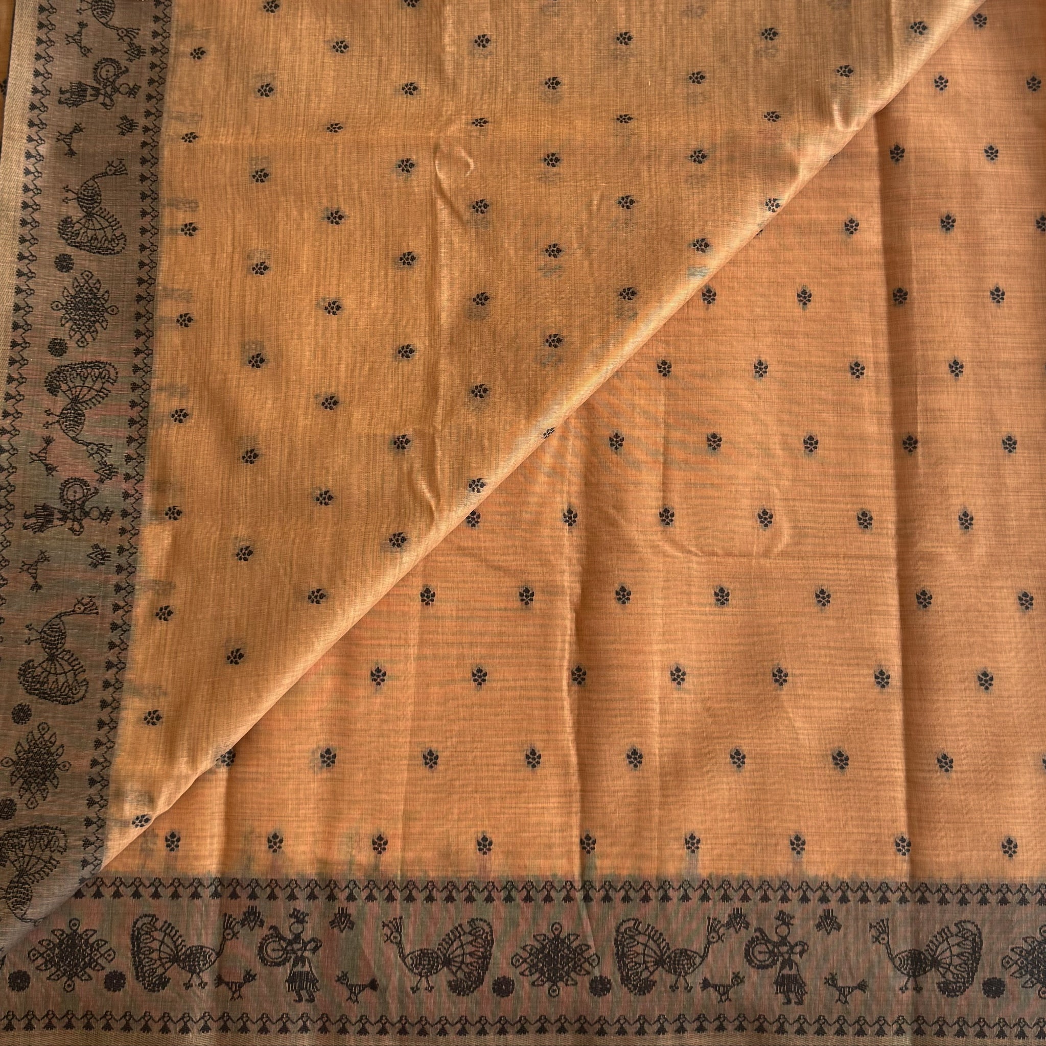 Elegant Muted Apricot Printed Tribal Pallu Saree With Tassel Border
