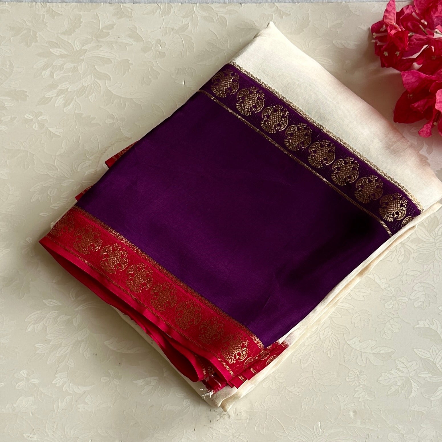 Magical Ivory with purple n pink soft crepe silk with gandaberunda borders