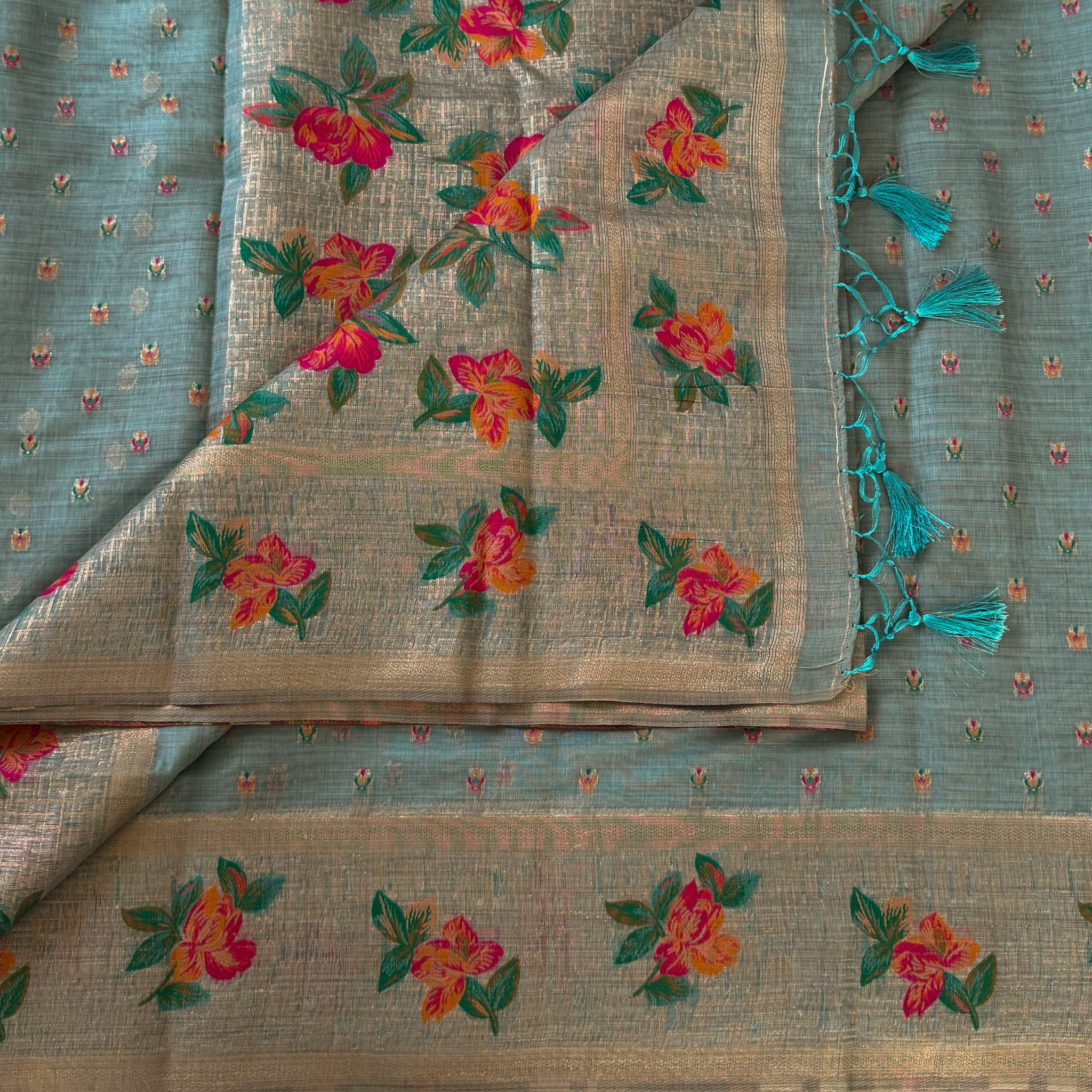 Festive Elegant Mint Green Floral Saree With Gold Zari Tassels