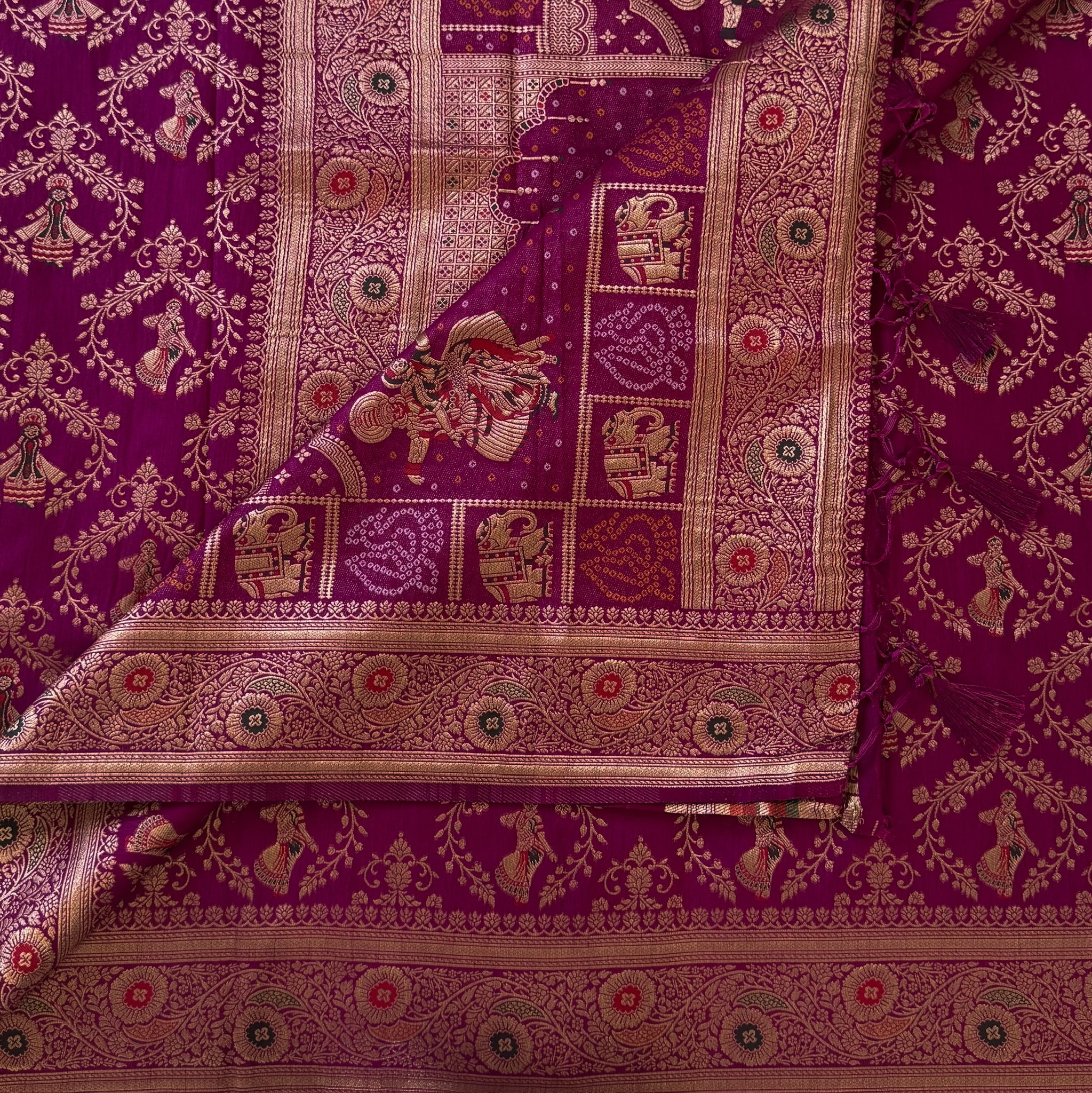 Magenta Gold Brocade Saree with Elephant Dancer Motifs and Tassels