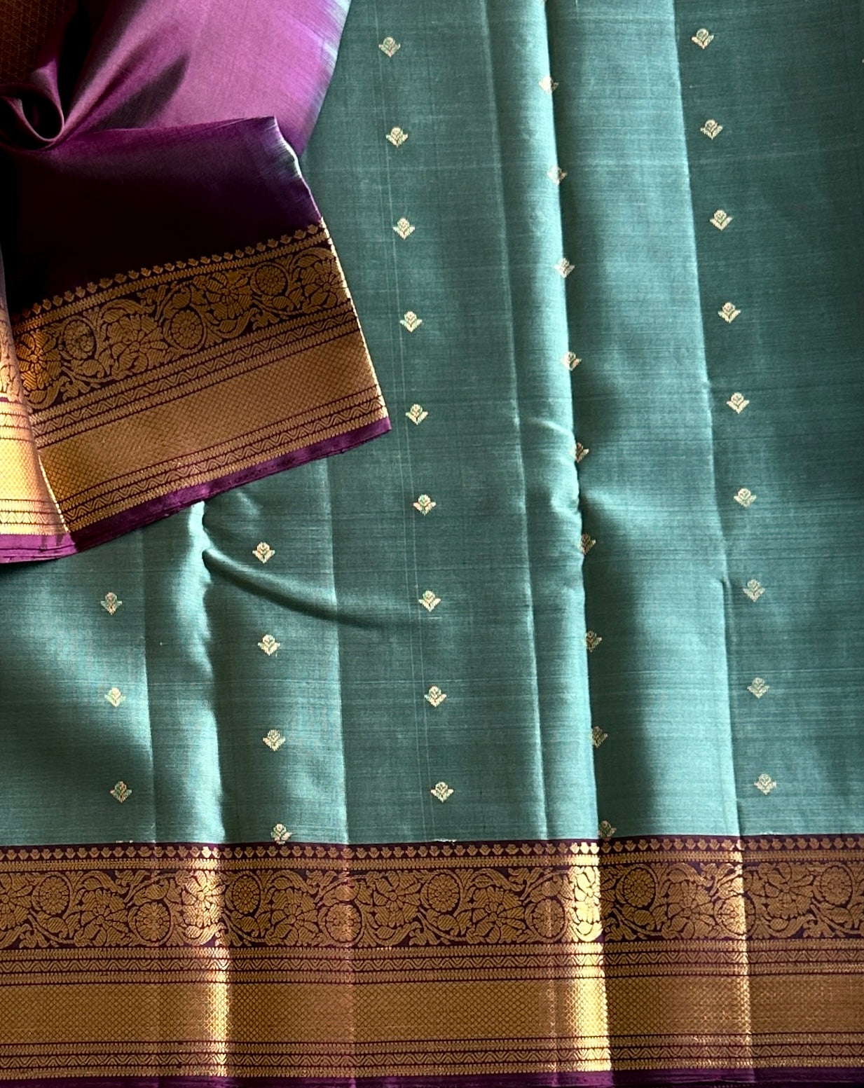 Teal Silk Saree with Plum Zari Border and Floral Pallu