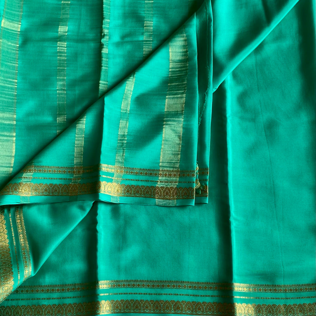 Magical Sea Green Mysore Crepe Silk Saree With Metallic Gold Border