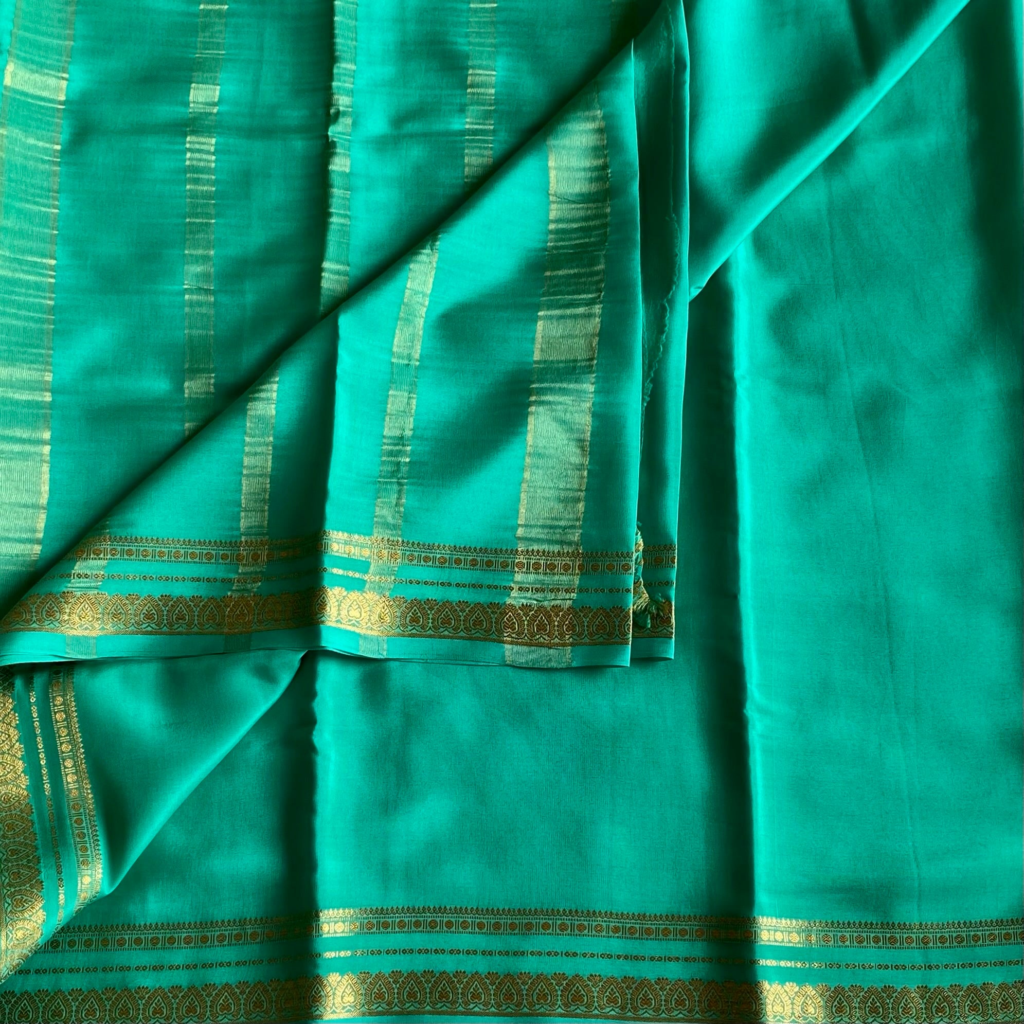 Magical Sea Green Mysore Crepe Silk Saree With Metallic Gold Border