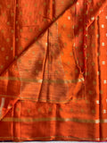 Burnt Orange soft crepe silk with zari woven buttas all over